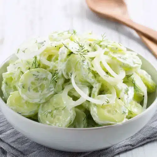 Delicious English cucumber salad with creamy dressing and fresh dill.