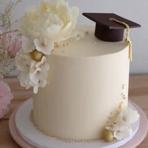 Floral graduation themed novelty cake for celebrations