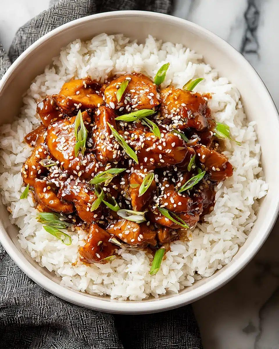 Honey garlic slow cooker chicken thighs dish on rice.