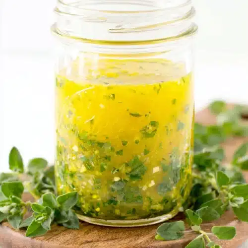 Lemon oregano salad dressing in a jar, zesty and fresh.