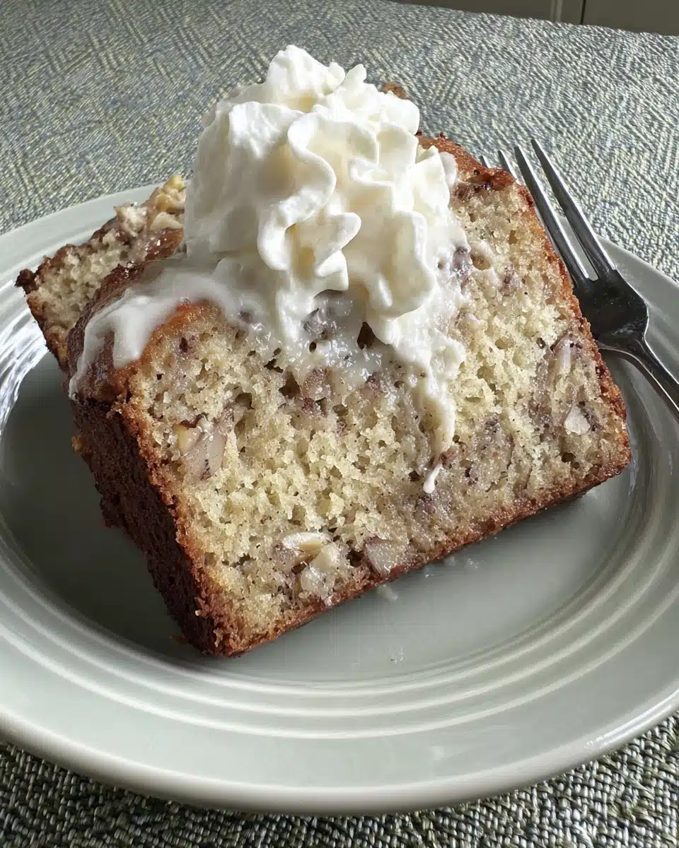 Delicious one bowl banana nut bread with whipped topping