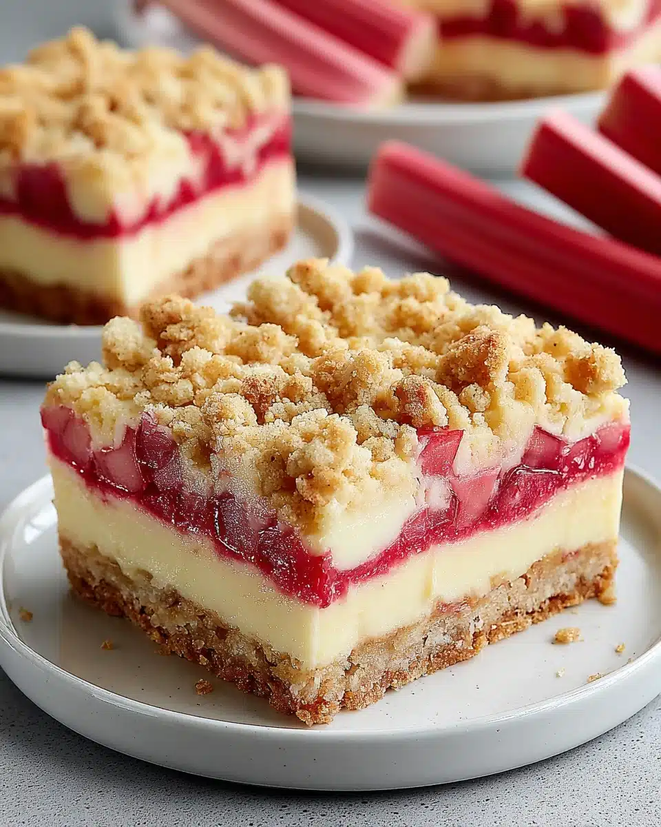 Rhubarb cream cheese dessert with a crumbly topping.