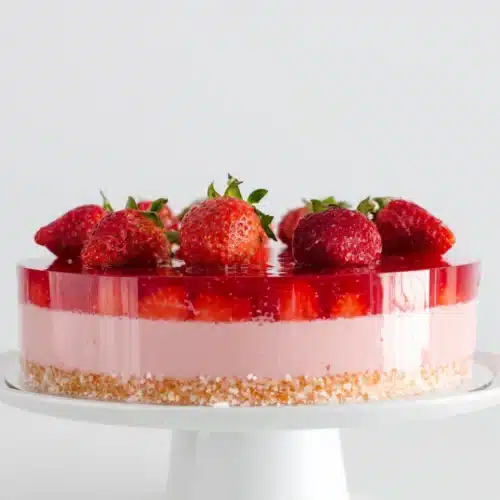 Delicious strawberry jello cake dessert for gatherings.