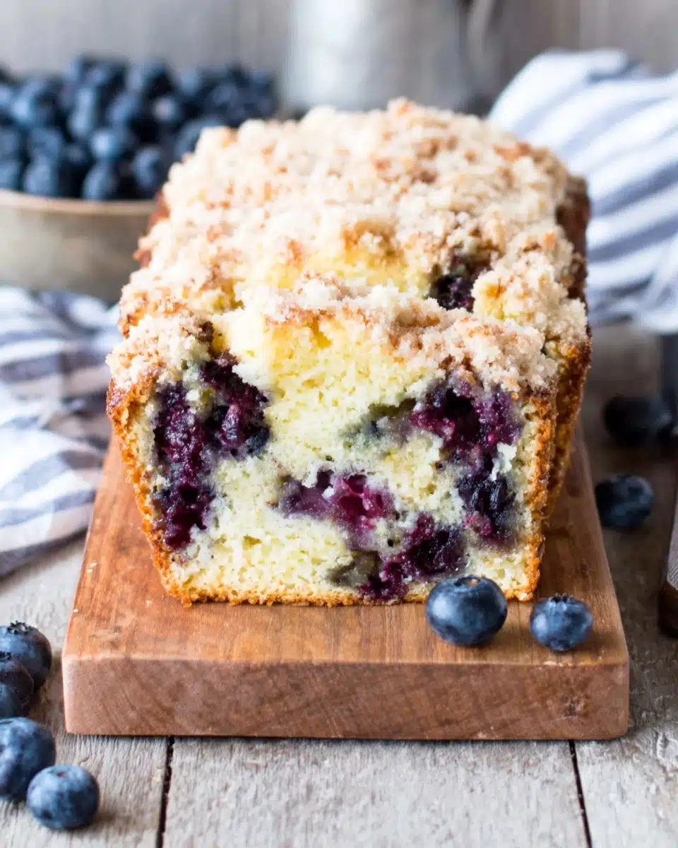Blueberry crumb coffee cake with crumb topping and fresh blueberries