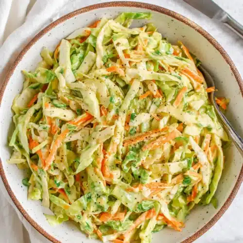 Creamy coleslaw with cabbage and carrots for chicken sandwich