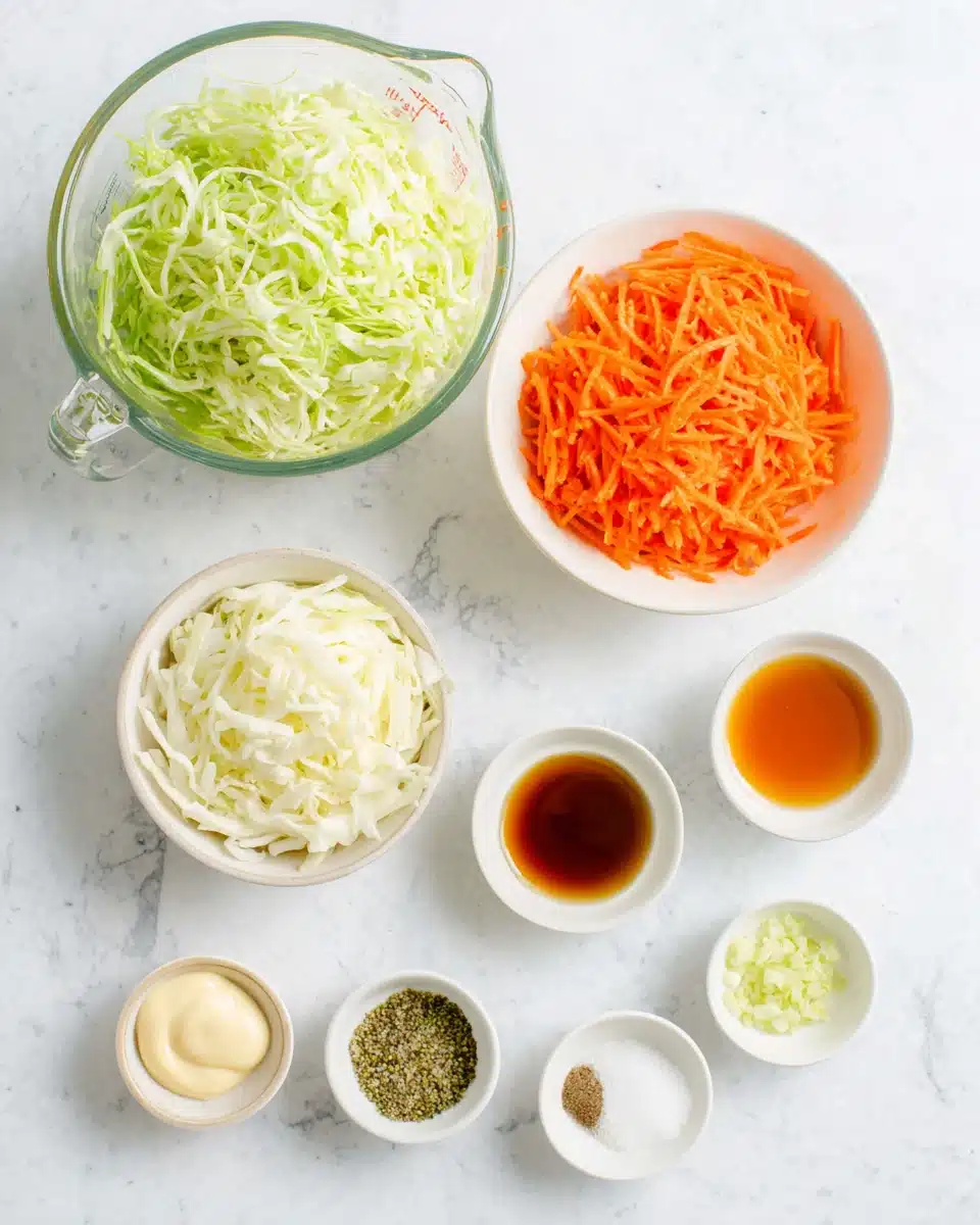 Coleslaw for chicken sandwich ingredients: shredded cabbage, carrots, mayonnaise, honey, vinegar, mustard, and spices.