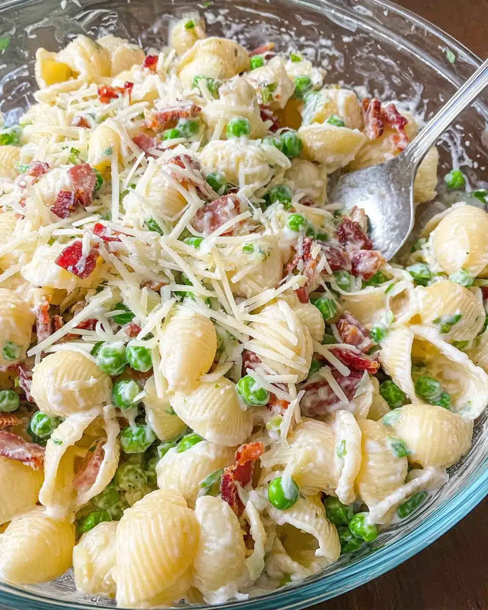 Creamy Pea and Bacon Pasta Salad with Parmesan Creamy pea and bacon pasta salad with shredded Parmesan cheese