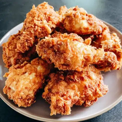 Crispy fried chicken pieces on a plate, golden and crunchy