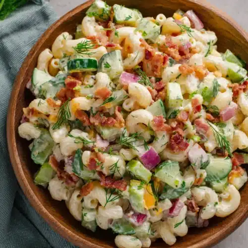 Dill Pickle Bacon Pasta Salad: A Flavorful Delight 1 Dill pickle bacon pasta salad with crispy bacon, pickles, and fresh dill in a wooden bowl