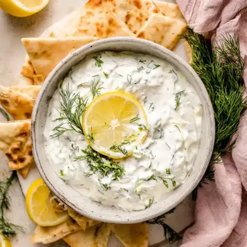 Easy Dairy-Free Tzatziki Recipe: Refreshingly Simple Delight 1 Creamy dairy-free tzatziki with dill and lemon, served with pita chips