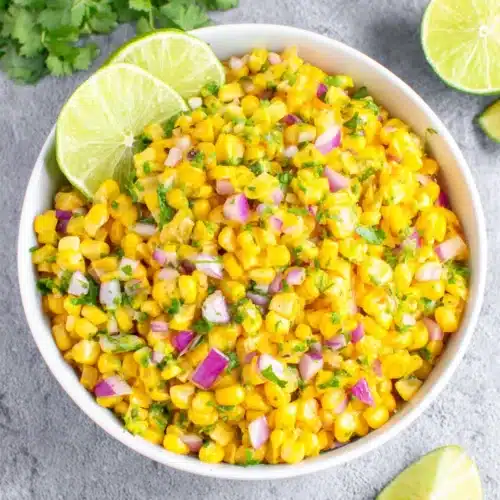 Homemade chipotle corn salsa with fresh corn, red onion, cilantro, and lime