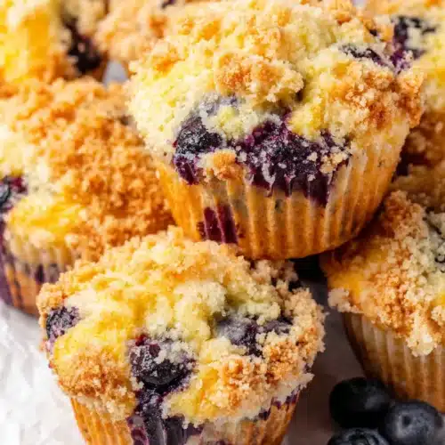 Moist Flavorful Blueberry Muffins: A Delightful Breakfast Treat 1 Moist flavorful blueberry muffins with crumb topping and juicy berries