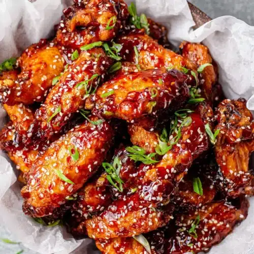 Sweet Sticky Honey Glazed Chicken Wings: Irresistibly Delicious 1 Sweet sticky honey glazed chicken wings with sesame seeds and green onions