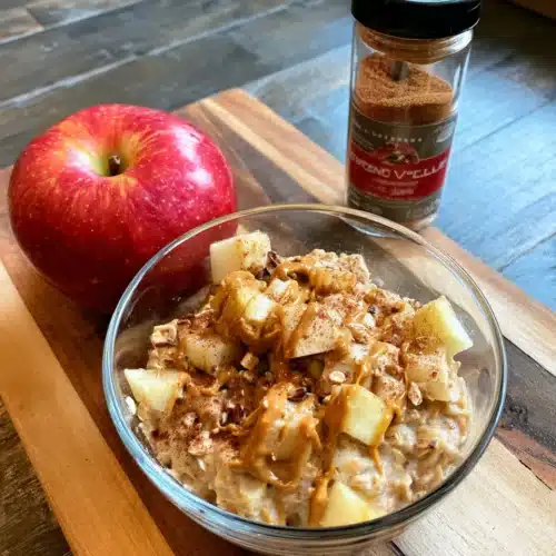 Classic overnight oats with apples and cinnamon in a glass bowl