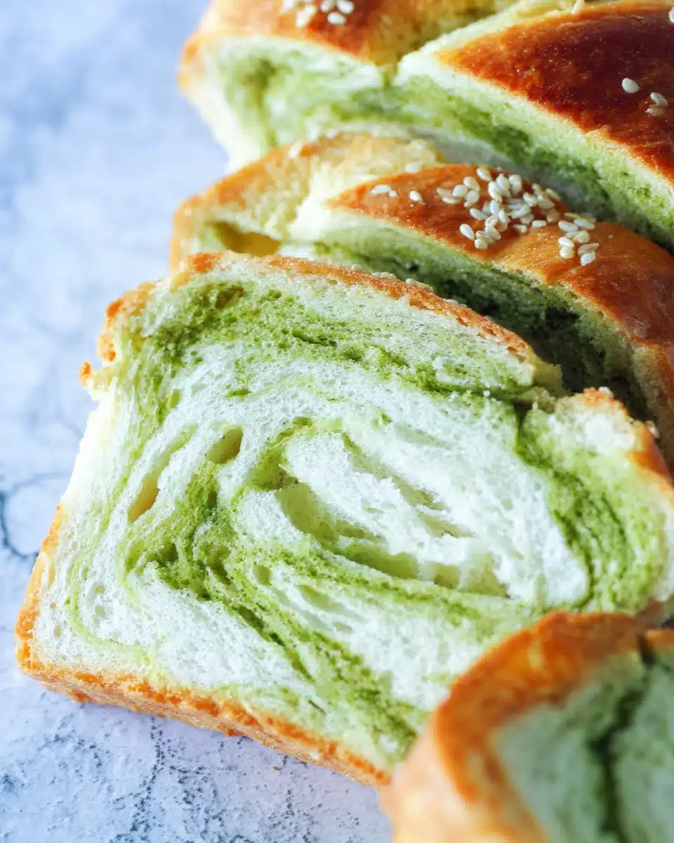 Sliced matcha and milk Japanese fluffy bread with green swirls and sesame seeds