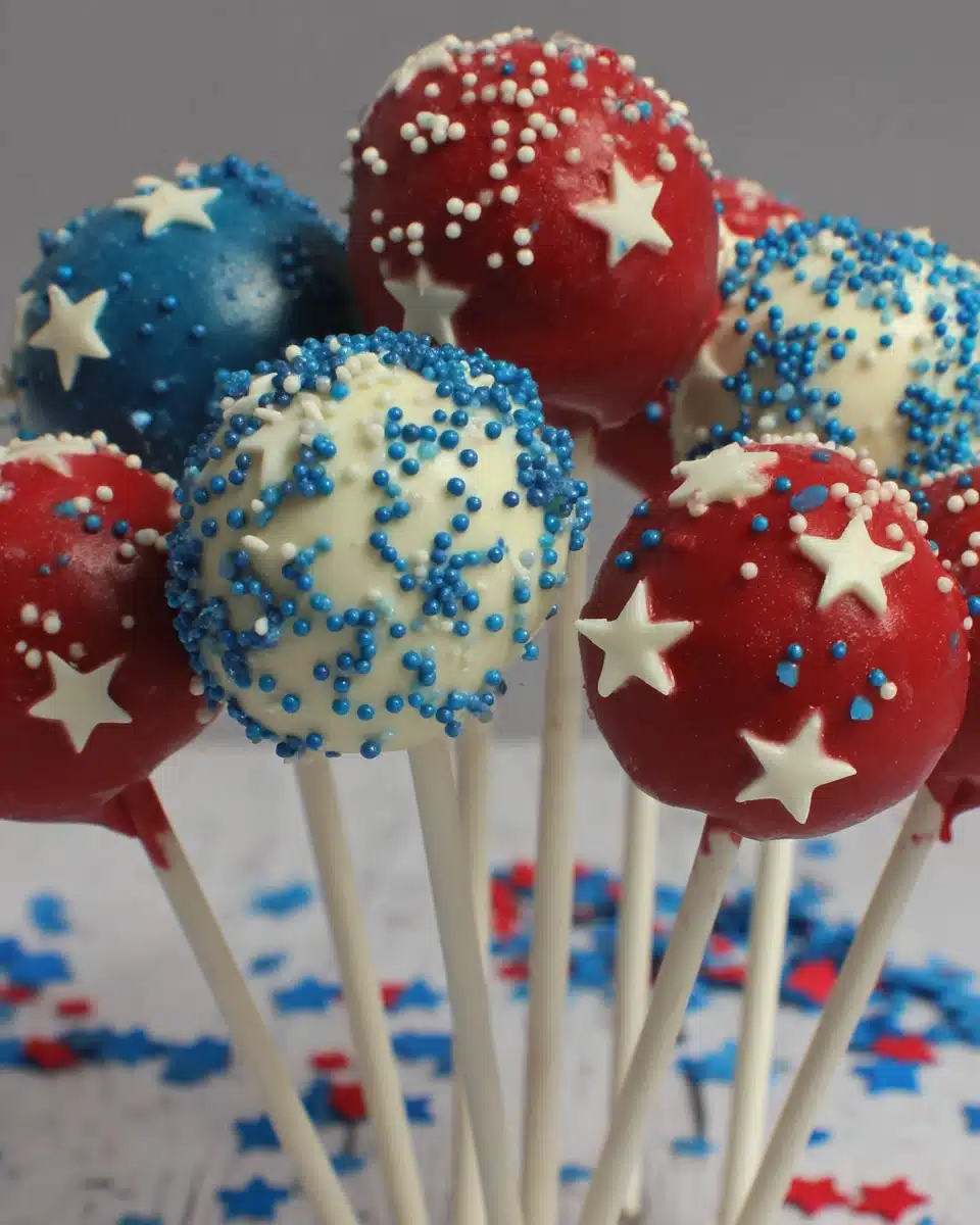 Red, white, and blue patriotic cake pops with star shapes and sprinkles