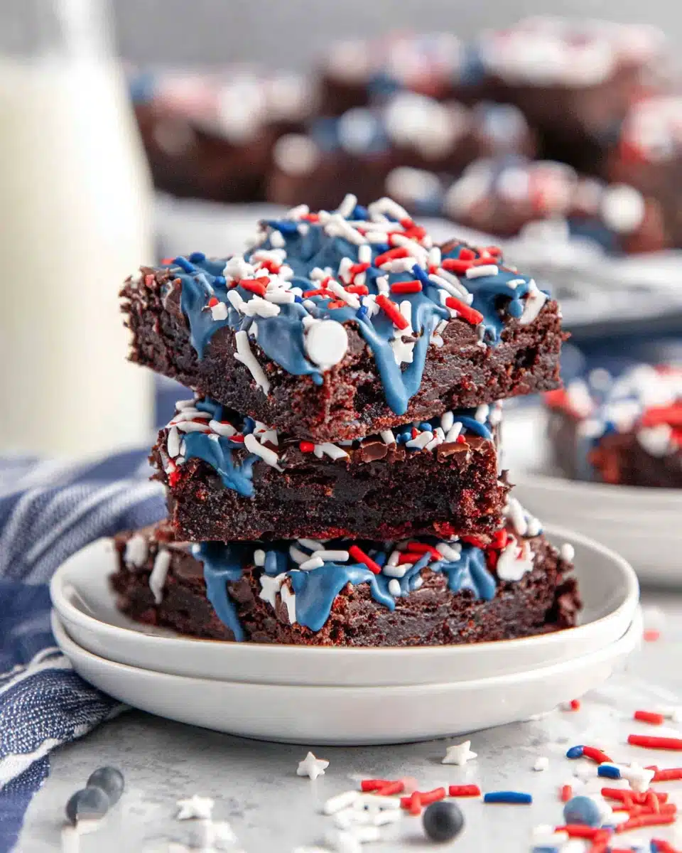 Star spangled brownies in star shapes with blue drizzle and red white blue sprinkles