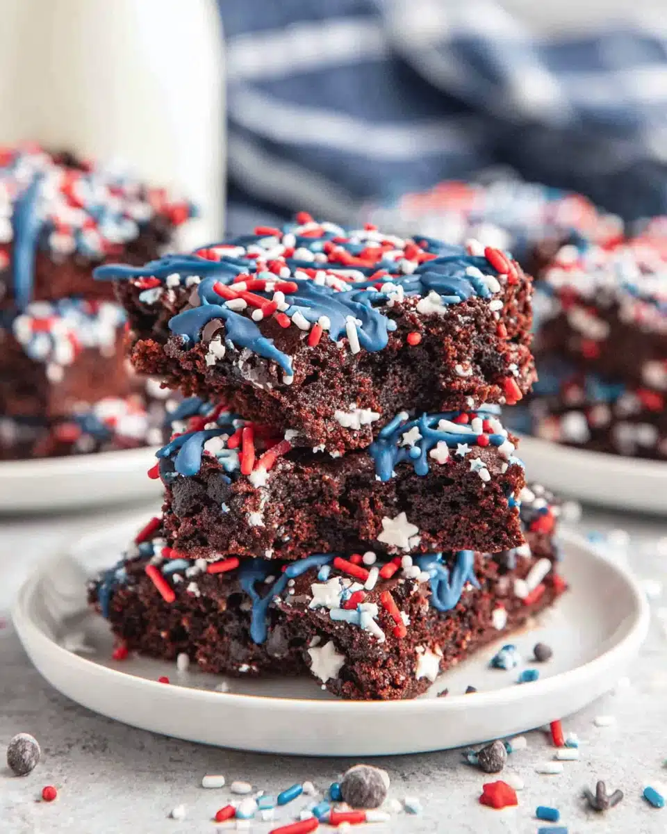 Star spangled brownies in star shapes with blue drizzle and red white blue sprinkles