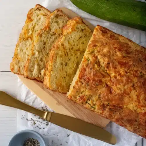 Sliced zucchini cheddar herb buttermilk quick bread with fresh zucchini and herbs